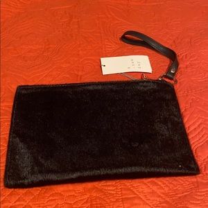 A. New Day Black Faux Fur Wristlet